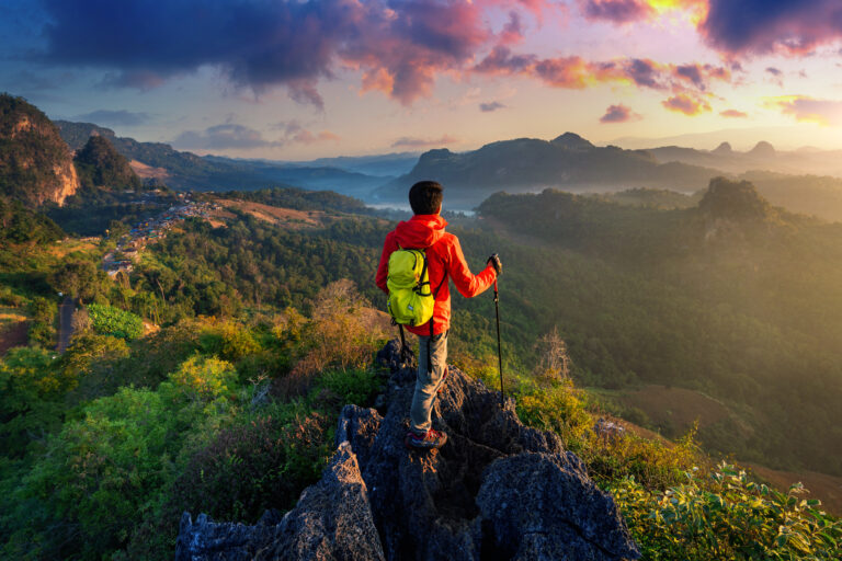 Personalised Travel 30 Backpacker standing on sunrise viewpoint at Ja Bo village, Mae hong son province, Thailand.